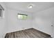 A cozy bedroom features a window with a pleasant view and light gray flooring at 641 E 104Th Pl, Northglenn, CO 80233