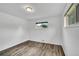 Bedroom featuring wood-look flooring and window to the backyard at 641 E 104Th Pl, Northglenn, CO 80233