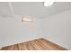 Minimalist room with light-colored walls, vinyl floors and one window at 641 E 104Th Pl, Northglenn, CO 80233