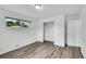Bright bedroom featuring neutral paint, wood-look flooring, window and closet at 641 E 104Th Pl, Northglenn, CO 80233