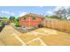 A brick home's exterior is complemented by a concrete driveway and a wooden fence at 641 E 104Th Pl, Northglenn, CO 80233
