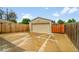 A detached garage with a wide driveway provides ample parking and storage space at 641 E 104Th Pl, Northglenn, CO 80233