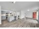 Bright, open-concept kitchen features modern flooring, stylish lighting, and appliances at 641 E 104Th Pl, Northglenn, CO 80233