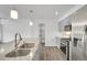 Modern kitchen featuring a large island with a granite countertop and stainless steel appliances at 641 E 104Th Pl, Northglenn, CO 80233