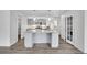 Modern kitchen featuring a large island with a granite countertop and stainless steel appliances at 641 E 104Th Pl, Northglenn, CO 80233