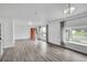 Bright living room featuring hardwood floors, large windows, and neutral paint, creating a modern atmosphere at 641 E 104Th Pl, Northglenn, CO 80233
