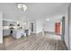 Bright, open-concept living area featuring modern flooring, stylish lighting, and a well-equipped kitchen at 641 E 104Th Pl, Northglenn, CO 80233