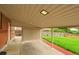 A covered patio provides a comfortable outdoor seating area with a view of the green backyard at 641 E 104Th Pl, Northglenn, CO 80233