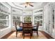 Sun-drenched breakfast nook offers picturesque views through bay windows creating a cozy space to enjoy meals at 7425 S Utica St, Littleton, CO 80128
