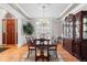 Elegant dining room with hardwood floors, a chandelier, and a large table perfect for entertaining guests at 7425 S Utica St, Littleton, CO 80128