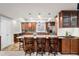 Kitchen island with seating and pendant lights, perfect for casual dining and entertaining at 7425 S Utica St, Littleton, CO 80128