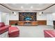 Inviting living room with custom built in shelving and trey ceiling at 7425 S Utica St, Littleton, CO 80128
