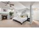 Comfortable main bedroom featuring a fireplace and neutral decor at 7425 S Utica St, Littleton, CO 80128