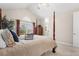 Vaulted bedroom with large windows and a four-poster bed creates a serene retreat at 7425 S Utica St, Littleton, CO 80128