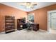 Bright home office with desk and shelving, adjacent to the private bathroom at 7425 S Utica St, Littleton, CO 80128
