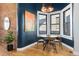 Bright dining area with bay window and modern decor at 3260 Curtis St, Denver, CO 80205