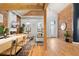 Bright entryway with hardwood floors and exposed brick wall at 3260 Curtis St, Denver, CO 80205