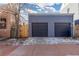 Two-car garage with automatic doors and ample parking space at 3260 Curtis St, Denver, CO 80205