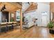 Open living area with exposed brick, hardwood floors, and a modern kitchen at 3260 Curtis St, Denver, CO 80205