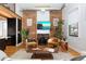 Living area with exposed brick, hardwood floors, and a modern feel at 3260 Curtis St, Denver, CO 80205