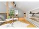 Open loft space, featuring wood floors and seating at 3260 Curtis St, Denver, CO 80205