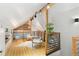 Bright loft area with wood floors and seating area at 3260 Curtis St, Denver, CO 80205