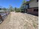 View of the backyard showing the house and fence at 327 S Pine St, Elizabeth, CO 80107