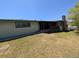 The exterior of the house features a backyard with a screened-in porch at 327 S Pine St, Elizabeth, CO 80107