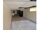 Open basement area with a small kitchen setup with appliances and tile flooring at 327 S Pine St, Elizabeth, CO 80107