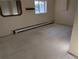 A spacious basement features a neutral color scheme, offering a blank canvas for customization at 327 S Pine St, Elizabeth, CO 80107