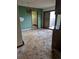 The dining room area has natural light, and entryways to other rooms at 327 S Pine St, Elizabeth, CO 80107