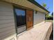 Exterior of a house showing a sliding glass door and wooden door at 327 S Pine St, Elizabeth, CO 80107