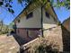 Back exterior of house showing brick and neutral siding at 327 S Pine St, Elizabeth, CO 80107