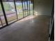 Enclosed back porch with screen windows overlooking the backyard and outdoor area at 327 S Pine St, Elizabeth, CO 80107