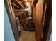 A utility room is pictured with furnace, water heater, and plumbing at 327 S Pine St, Elizabeth, CO 80107