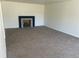 Spacious room with a fireplace and neutral carpet at 5449 S Locust St, Greenwood Village, CO 80111