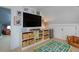 Versatile attic space featuring a large TV, built-in storage, and a play area for entertainment and relaxation at 747 N Downing St, Denver, CO 80218