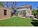 Lush backyard featuring a well-maintained lawn and a cozy outdoor lounge area at 747 N Downing St, Denver, CO 80218