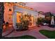 Twilight view of the home's exterior highlighting a beautiful sunroom and outdoor patio area at 747 N Downing St, Denver, CO 80218