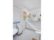 Bright bathroom featuring a soaking tub, double vanity, large mirror, and stylish fixtures at 747 N Downing St, Denver, CO 80218