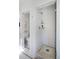 Stylish bathroom with glass enclosed shower and black and white tile flooring at 747 N Downing St, Denver, CO 80218