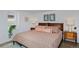 Cozy bedroom featuring a patterned bedspread, side tables, and decor for a relaxing atmosphere at 747 N Downing St, Denver, CO 80218