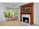 Bedroom sitting area with fireplace and large bay window overlooking lush landscaping at 747 N Downing St, Denver, CO 80218