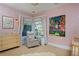 Bright Bedroom with pink stripe wallpaper, light wood furniture, and custom artwork at 747 N Downing St, Denver, CO 80218