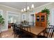 Traditional dining room with hardwood floors, an area rug, and views to other rooms and large cabinet at 747 N Downing St, Denver, CO 80218