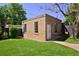 Charming backyard with a detached garage and well-maintained lawn, perfect for outdoor activities at 747 N Downing St, Denver, CO 80218