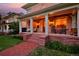 Inviting front porch with warm lighting and classic rocking chairs, creating a cozy atmosphere at 747 N Downing St, Denver, CO 80218