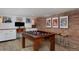 Basement game room featuring a pool table and desk area, perfect for entertainment and relaxation at 747 N Downing St, Denver, CO 80218