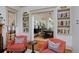 Charming living room with built-in bookshelves, decorative chairs, and a view of the dining area, creating an inviting atmosphere at 747 N Downing St, Denver, CO 80218
