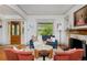 Cozy living room with a classic fireplace, bright window and elegant decor perfect for relaxing or entertaining guests at 747 N Downing St, Denver, CO 80218
